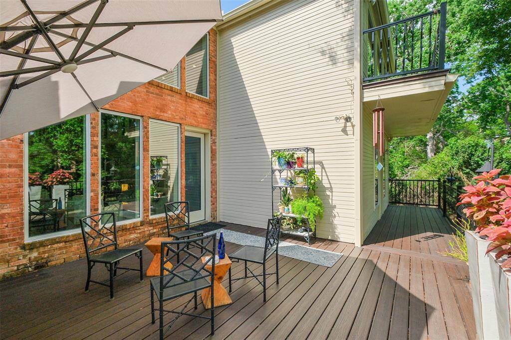 The deck off the living room is ideal for open-air entertaining with calming bayou views.