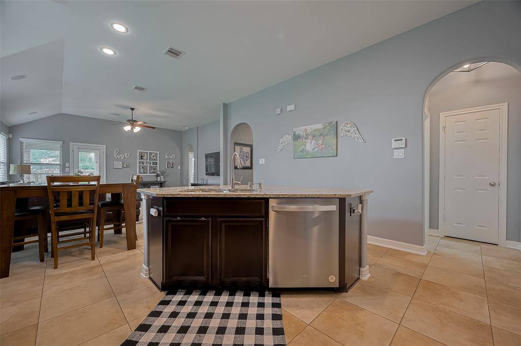Expansive island with sink and ample prep space.