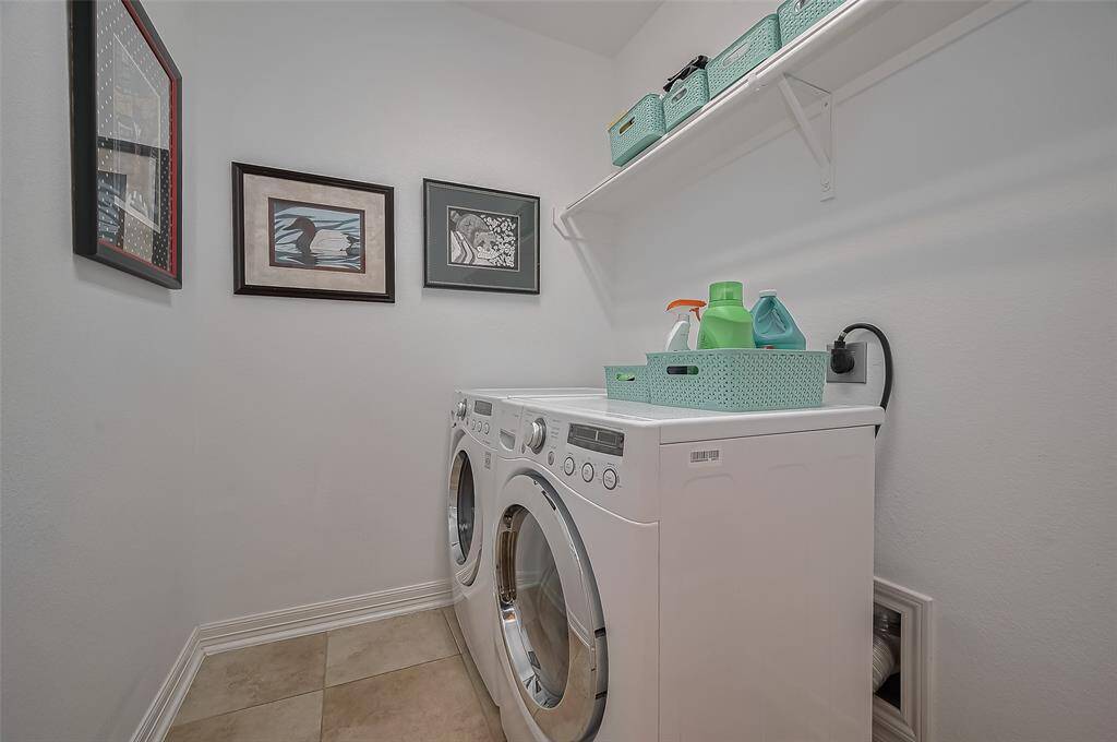 Spacious laundry room with ample storage.