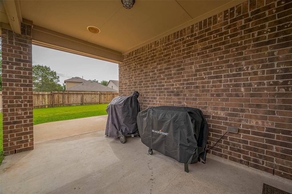 Enjoy outdoor living with a spacious covered patio, perfect for relaxing or entertaining.