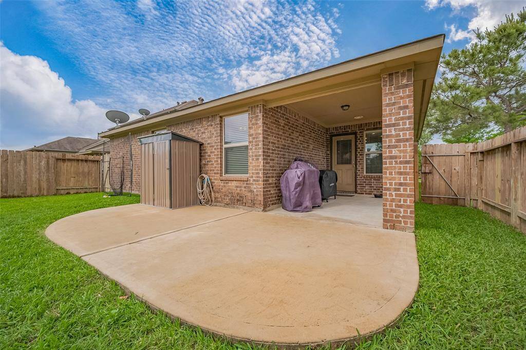 Spacious back patio for outdoor enjoyment.