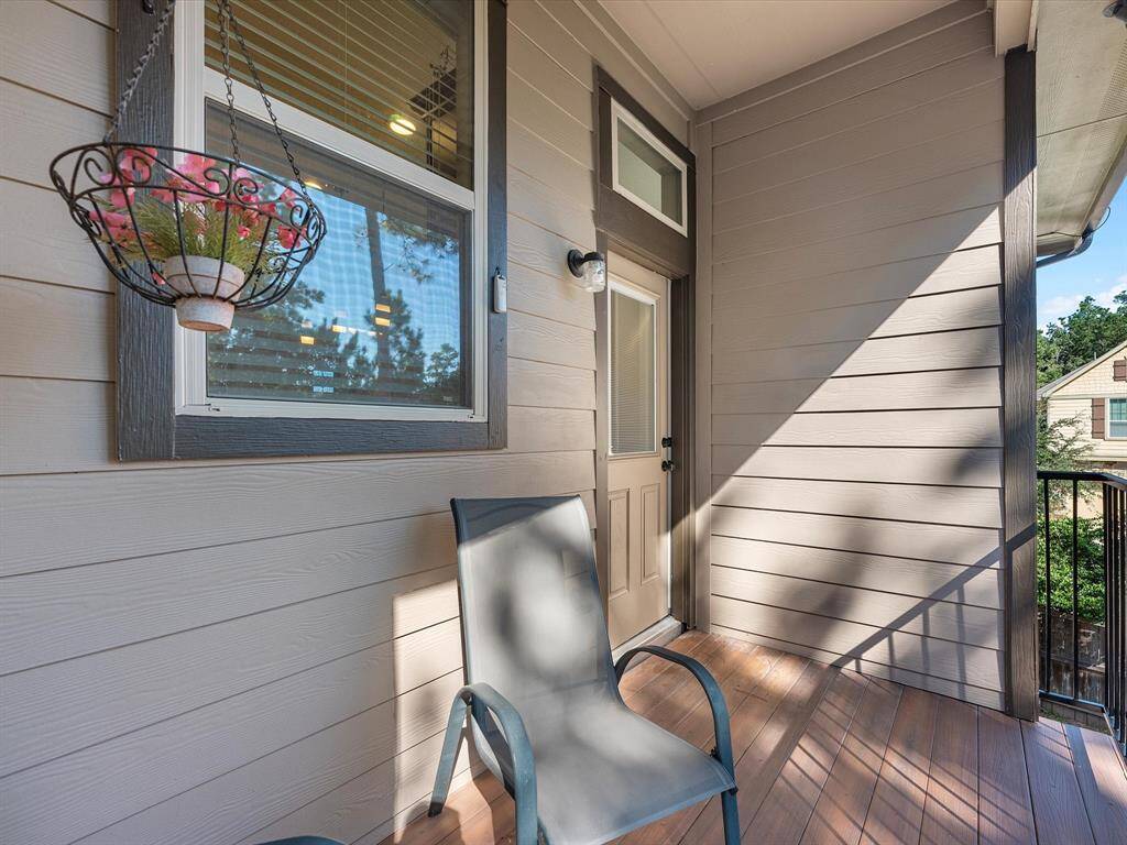 View of the upstairs balcony from the kitchen and dining area. Perfect to enjoy your morning coffee!