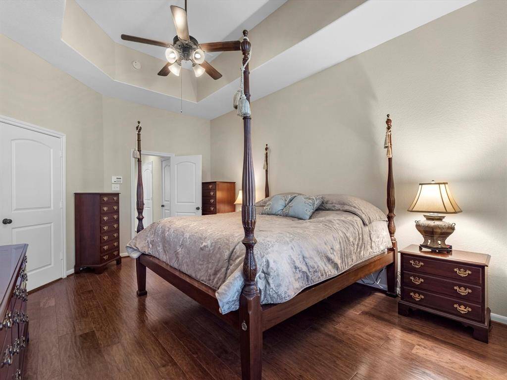 Primary bedroom with tray ceiling