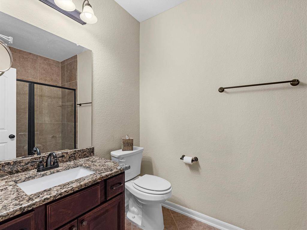Full guest bathroom with granite and large shower