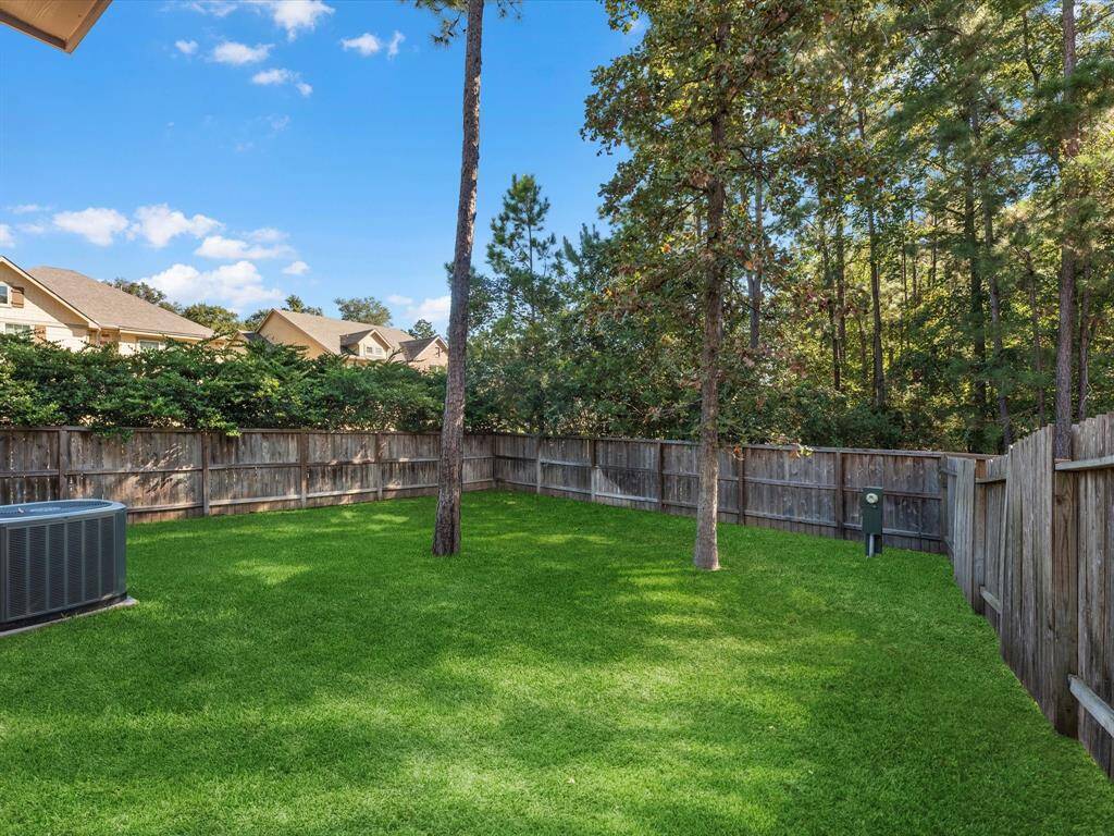 View of the backyard with NO BACK NEIGHBORS from the downstairs covered patio