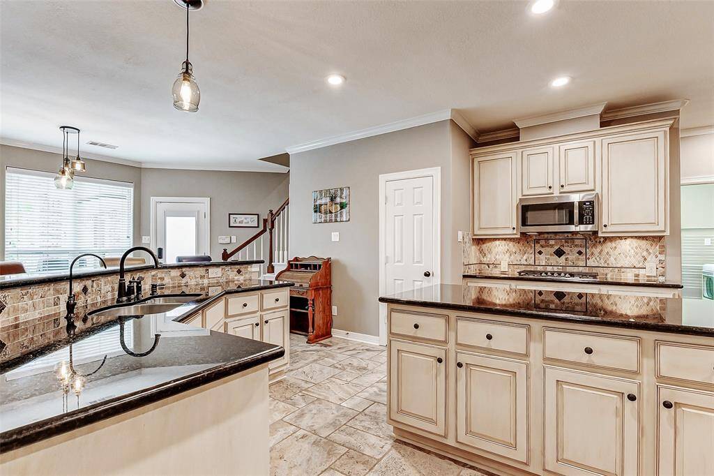 The kitchen seamlessly integrates with the open living and breakfast areas, perfect for modern living.