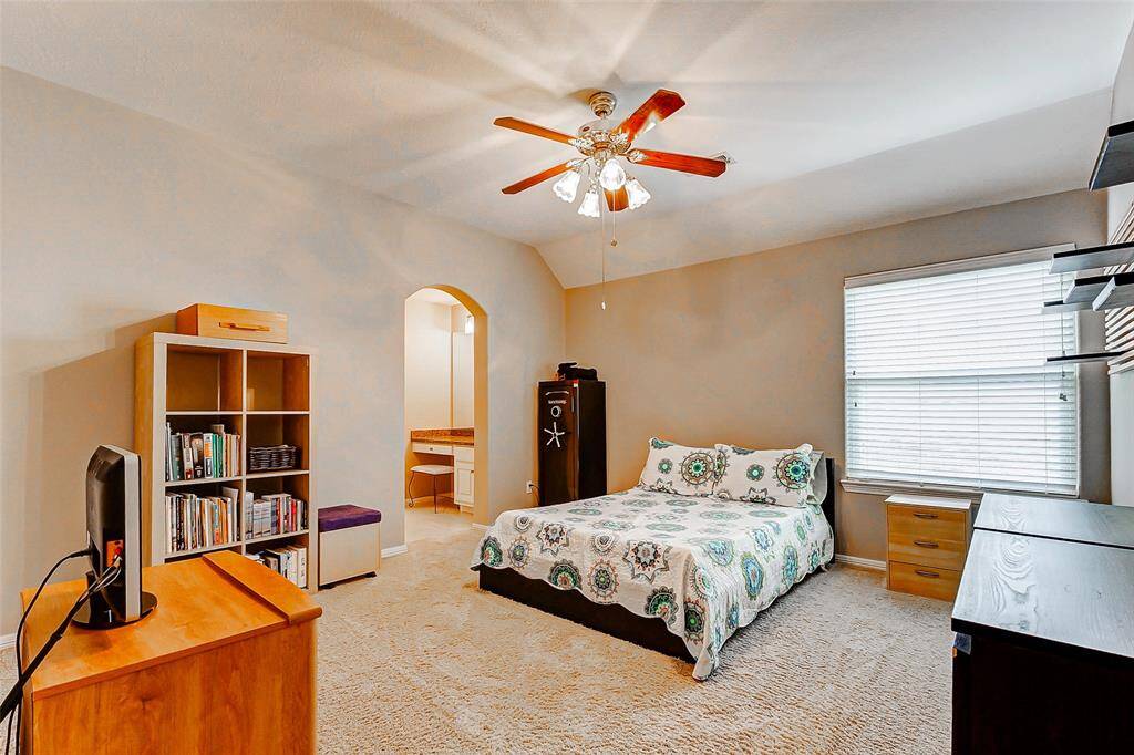 Generous secondary bedroom featuring an attached Jack and Jill bathroom.