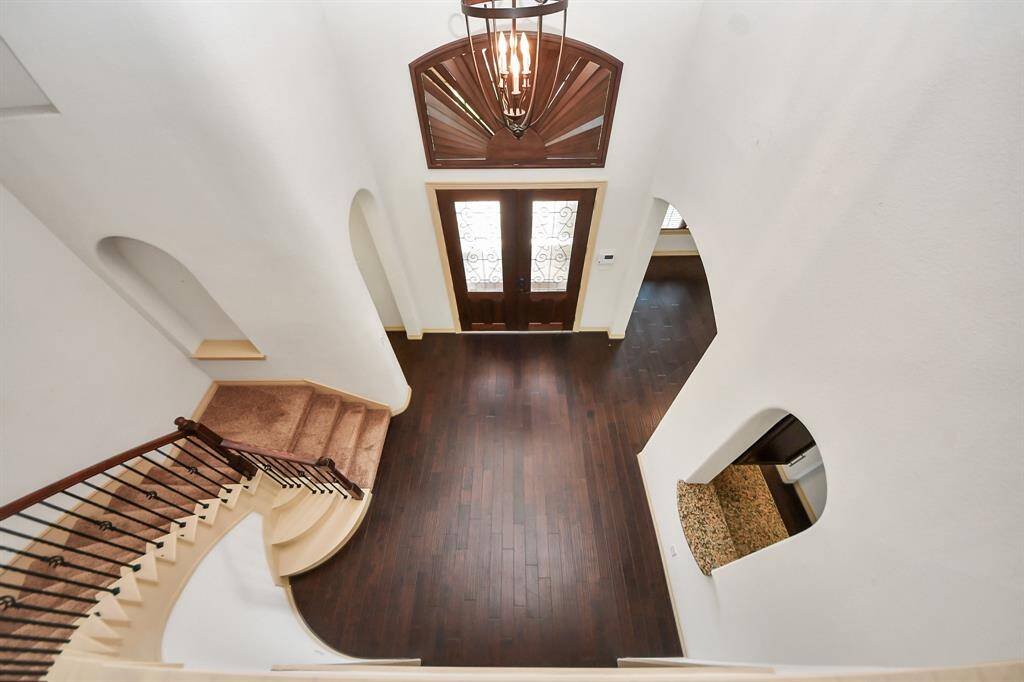 Gracefully take the spiral stairway to 3 more bedrooms, study area, game and media room