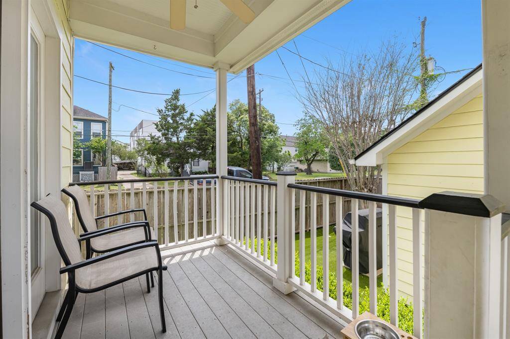 Covered back porch also features synthetic decking