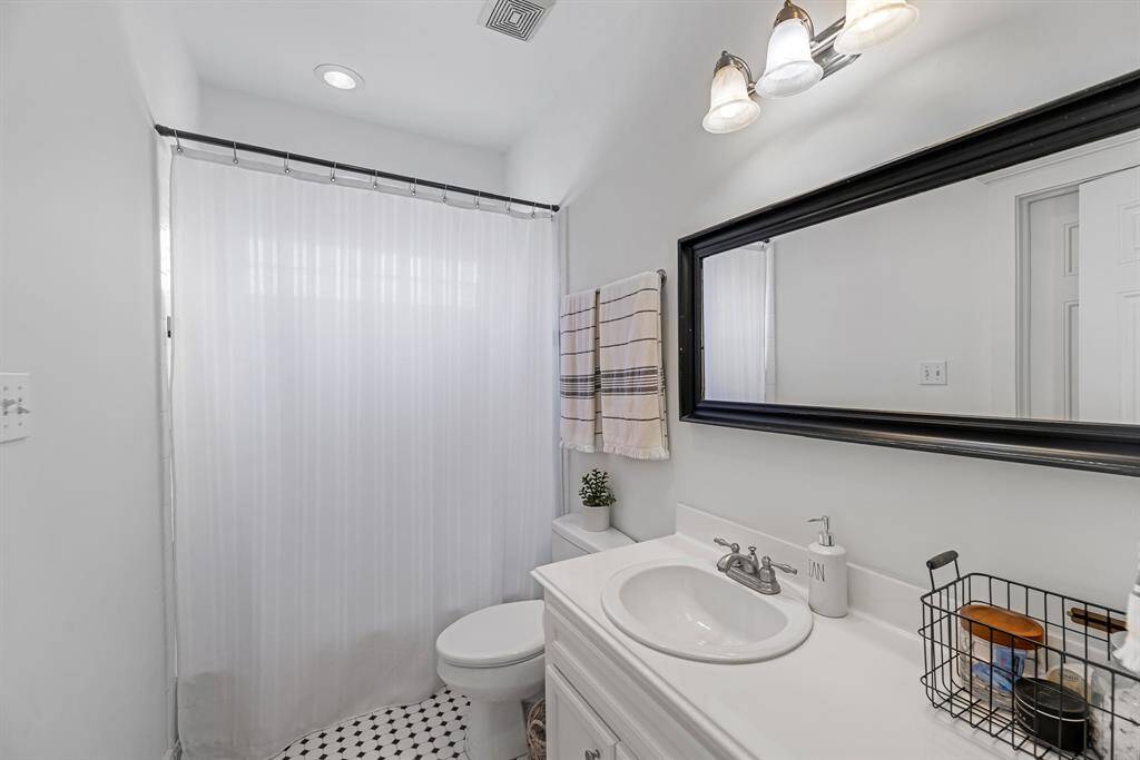 Secondary bath has a shower/tub combination