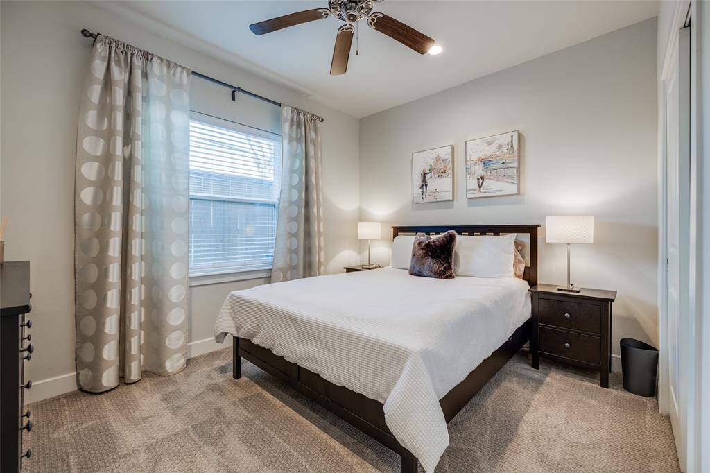 Bedroom 2 on first floor, with access to shared bathroom, ceiling fan, 2 in blinds, carpet, large closet