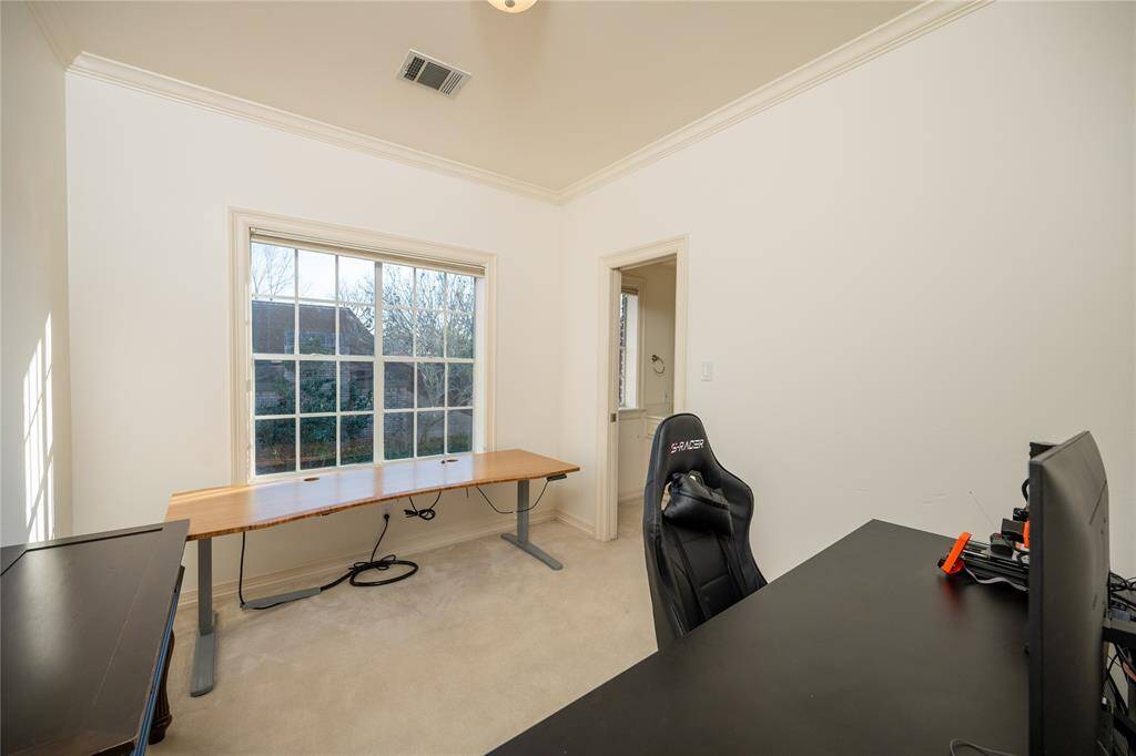 This bright and versatile office space features high ceilings, large windows that bring in abundant natural light, and a spacious layout.