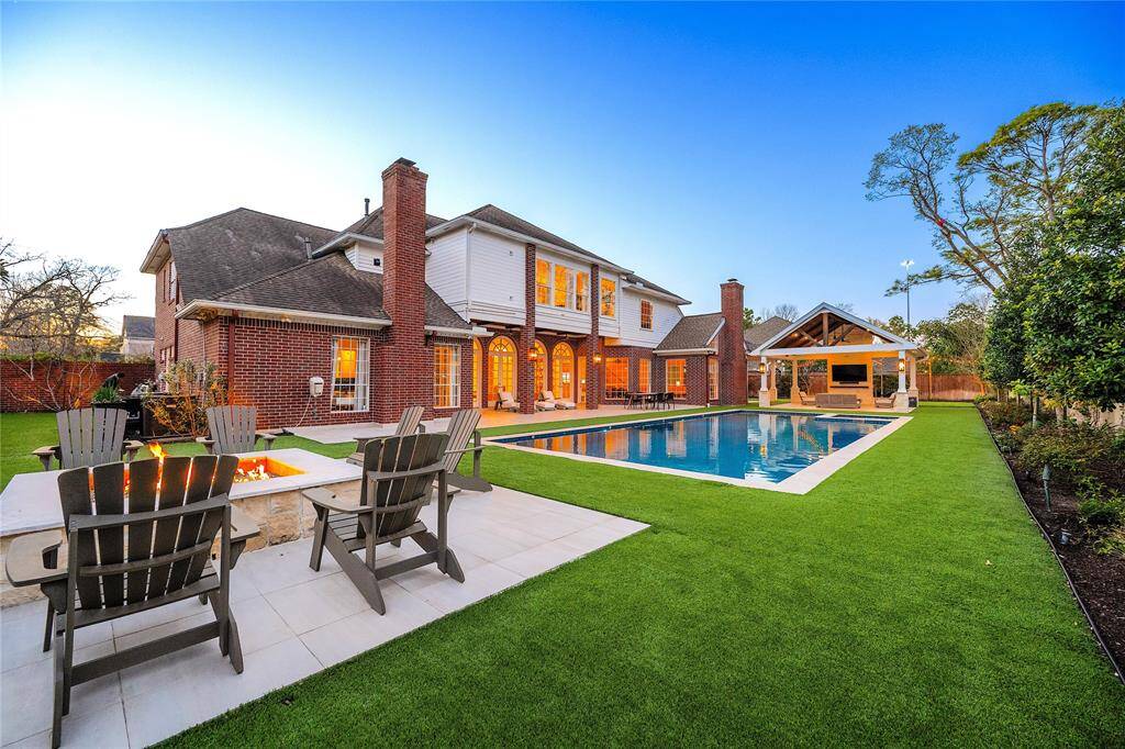 Fully covered with high-end artificial grass in the backyard.