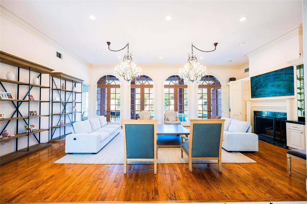 Formal living room with french doors leading to a 50ft pool.