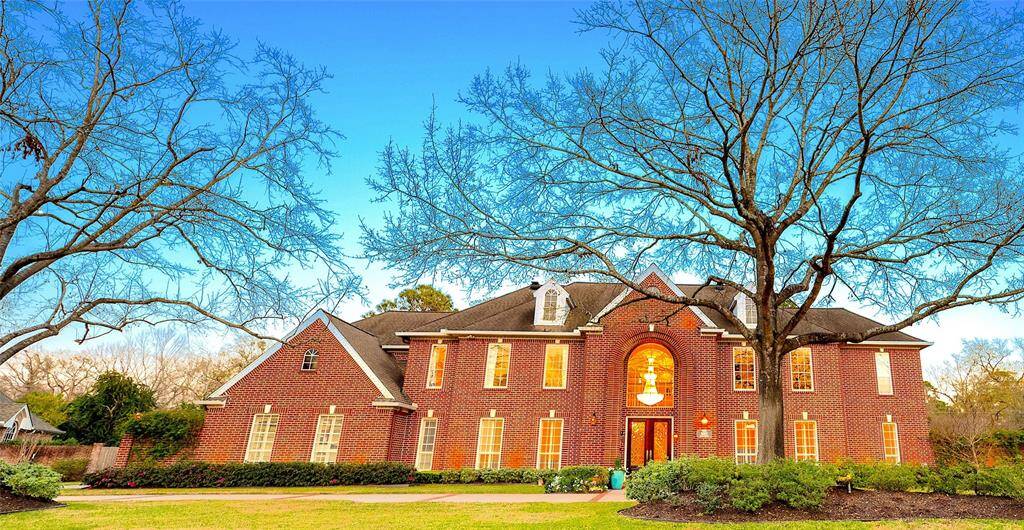 glowing curb appeal, and a grand presence in a serene setting.