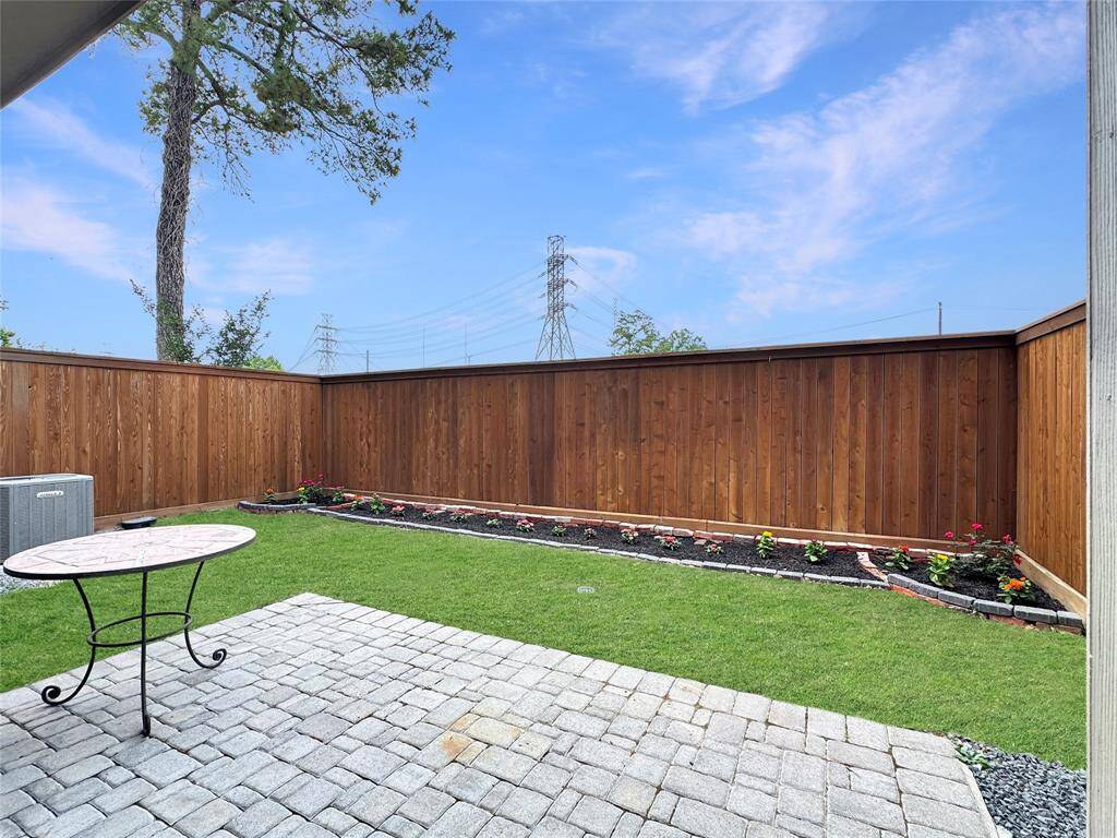 Private back patio. Grass enhanced for images.