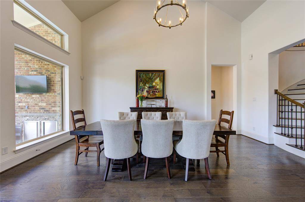 Spacious dining room with expansive windows, perfect for large gatherings.