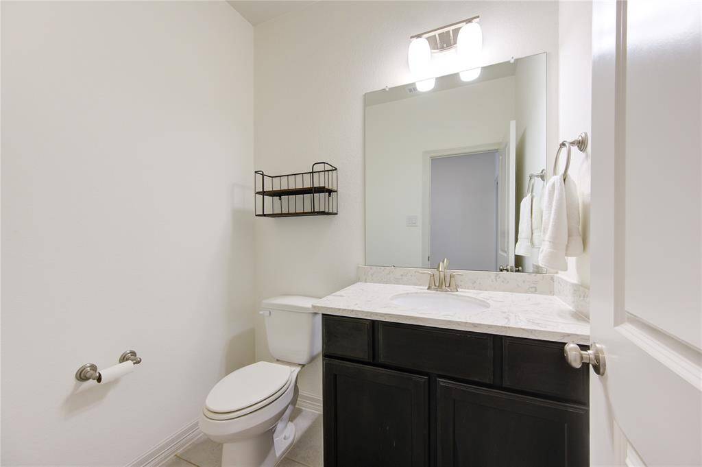 Convenient upstairs half bath for the game and media room access.