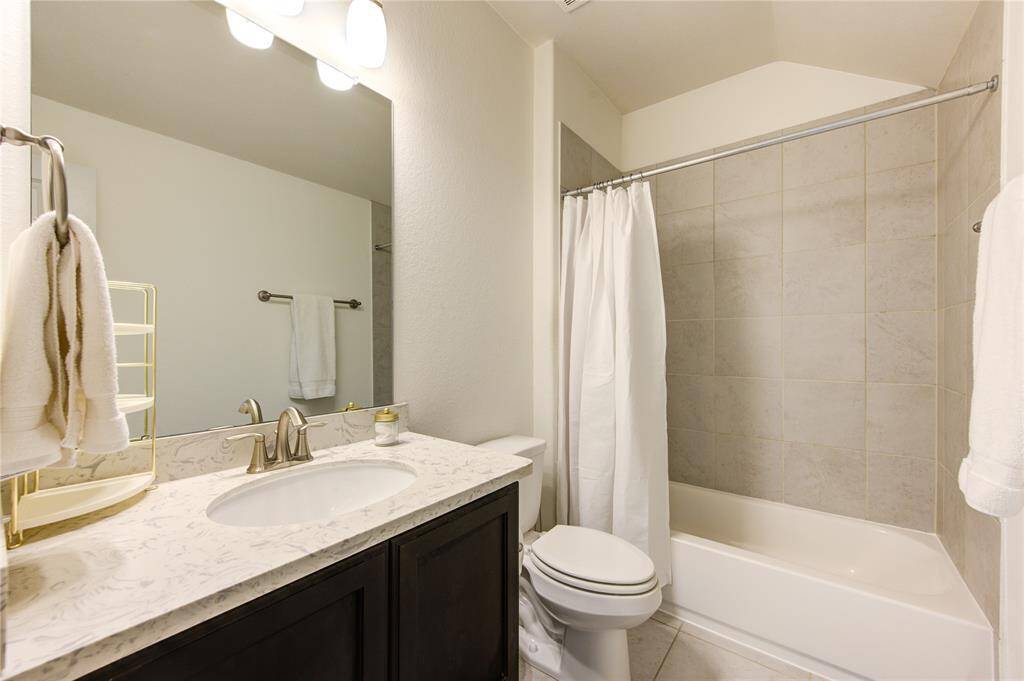 Spacious en-suite bathroom in Bedroom #3 with ample counter space.