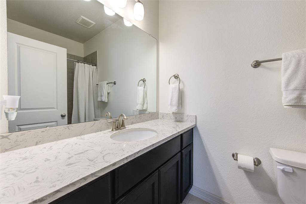 En-Suite Bath #4 boasts generous counter space for your convenience.