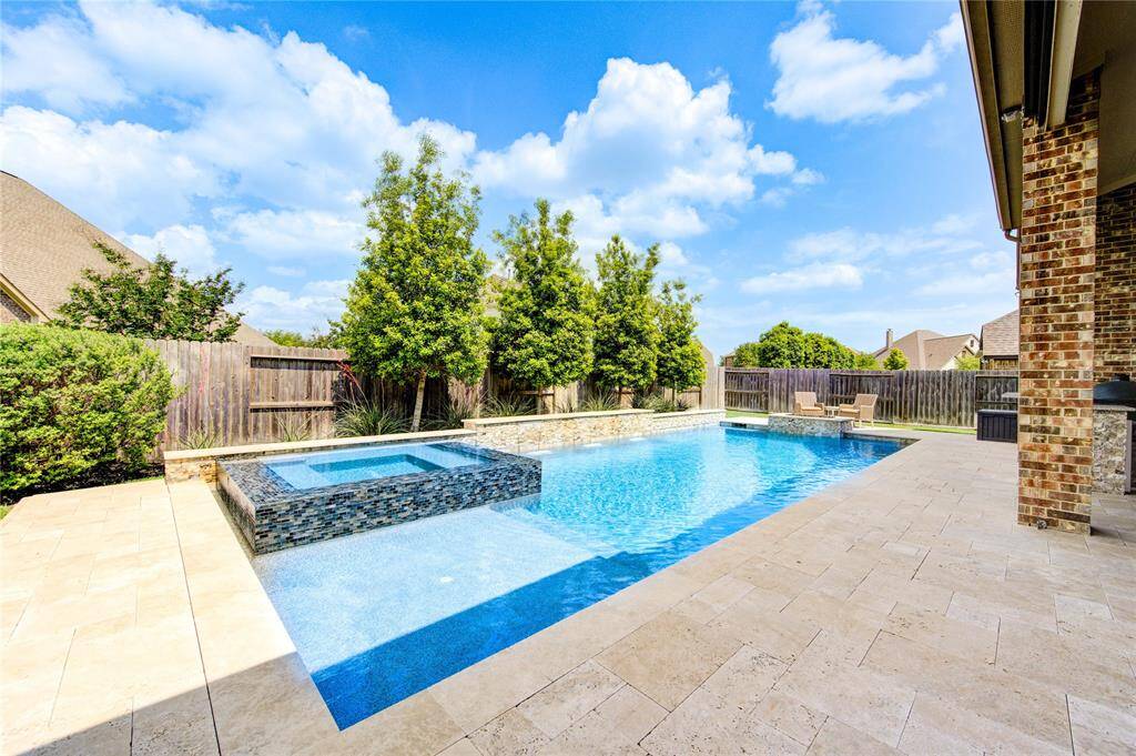 Enjoy the sun on the pool's tanning ledge, cool off in the water, or relax in the hot tub.