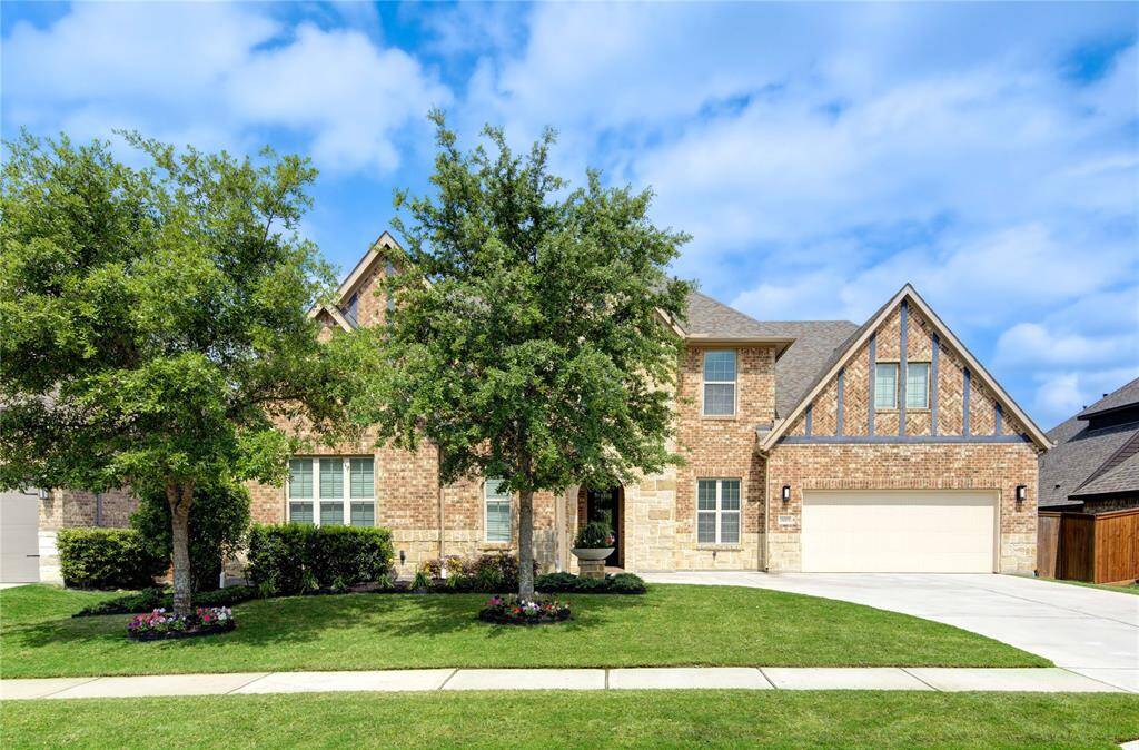 Charming two-story brick home with a well-maintained front yard. Mature trees, and a lush lawn offers excellent curb appeal.