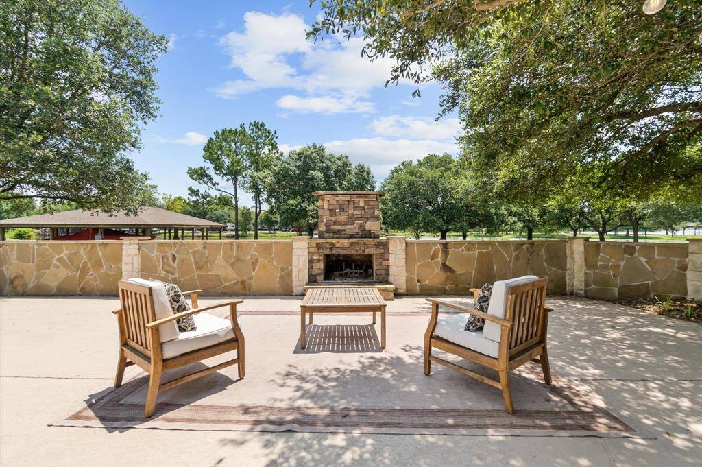 Poolside fireplace for chilly evenings and ambiance
