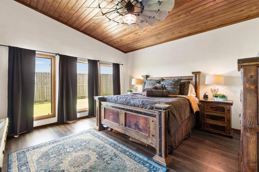 Primary w/wood ceiling and a generously sized fan. 1st floor