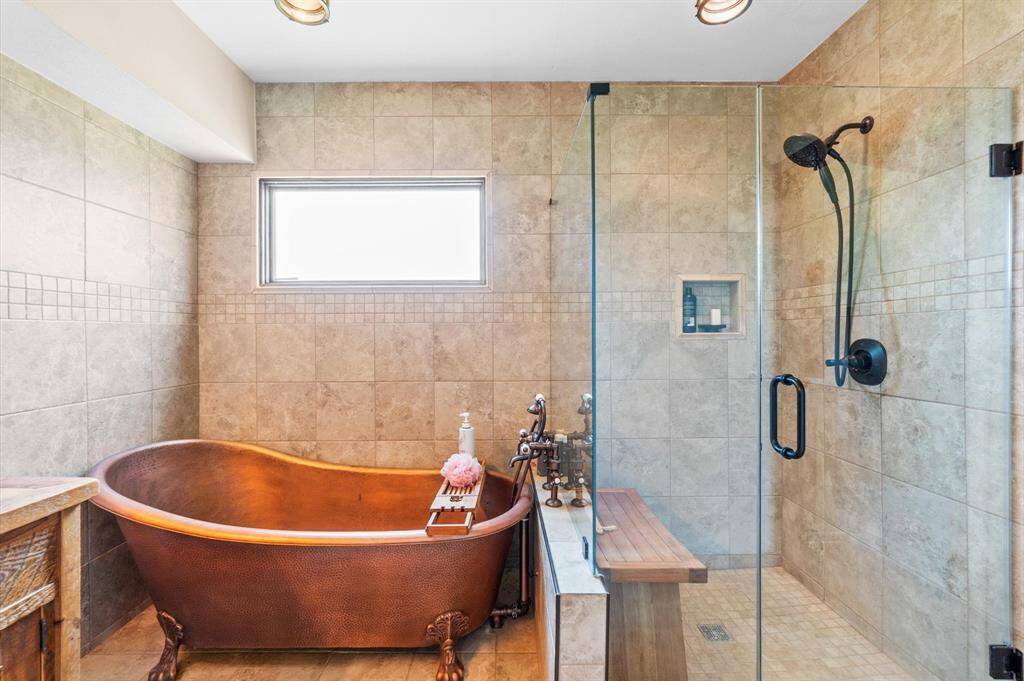 Copper soaking tub and separate shower.