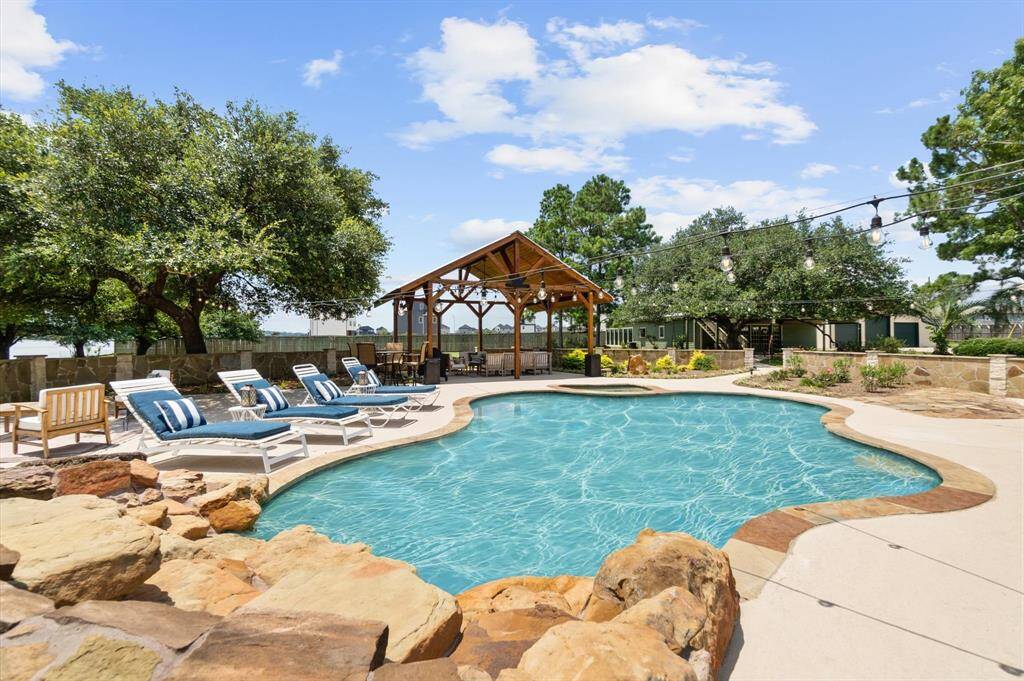 Pool side: sunbathing & beautifully crafted custom wood pavilion