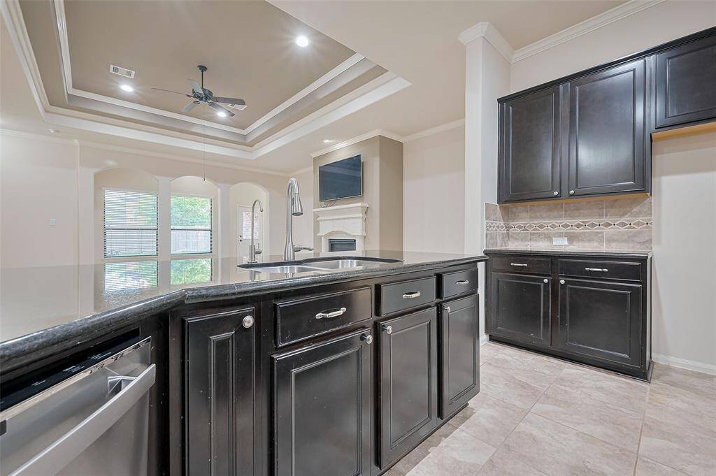 View from kitchen into the open living area—perfect for entertaining and enjoying the backyard view!