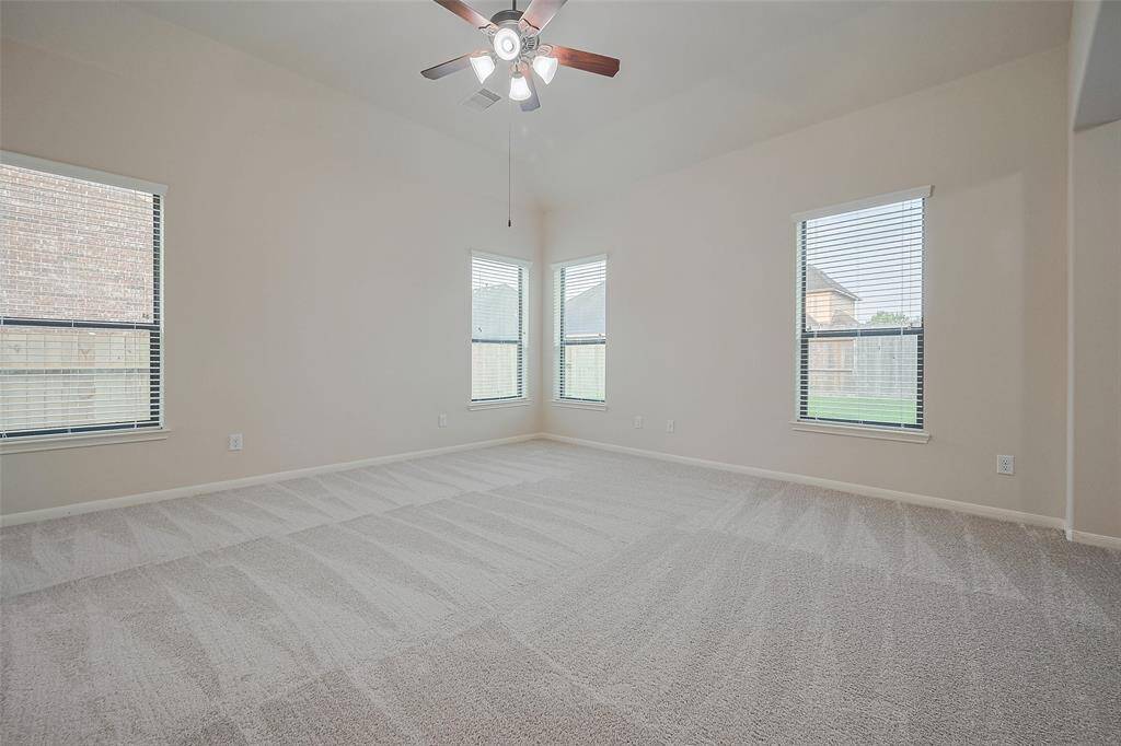 LARGE primary bedroom, plenty of space and light, bright and airy with high ceilings or draw the shades for secluded tranquility and privacy