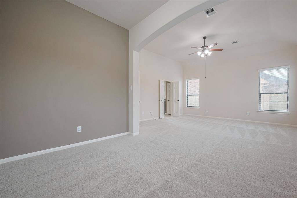 Another view of the primary bedroom from the bonus/flex space