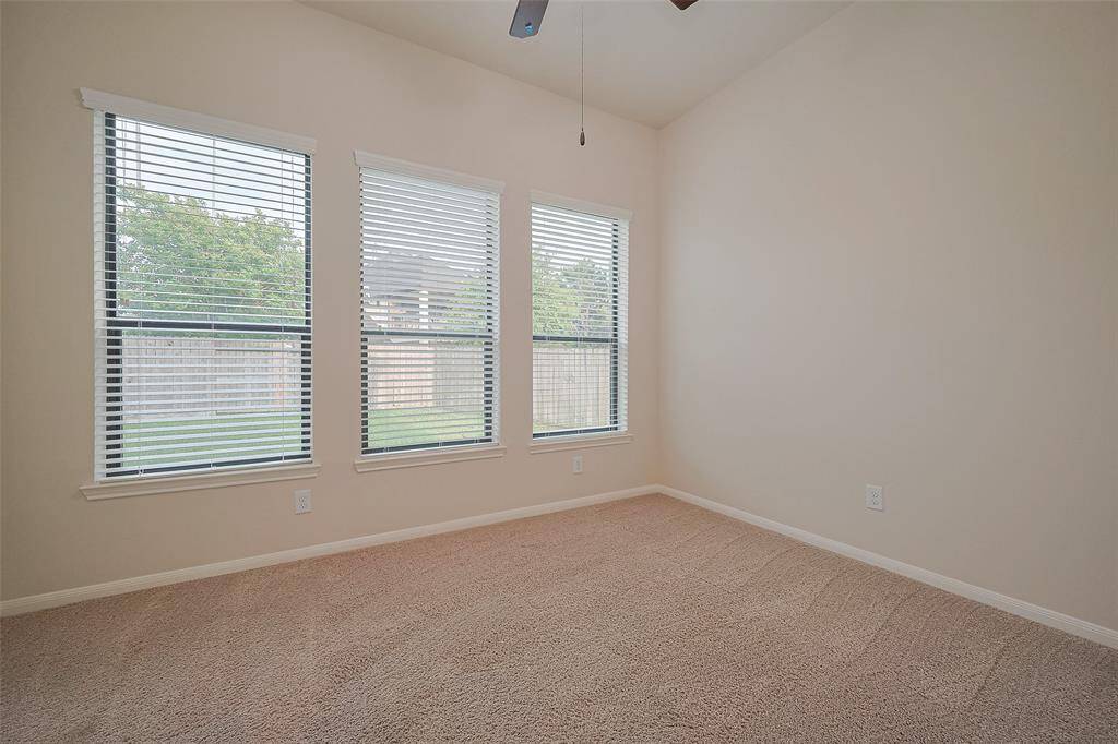 bonus room view of the backyard and green space for quiet relaxation in comfort!