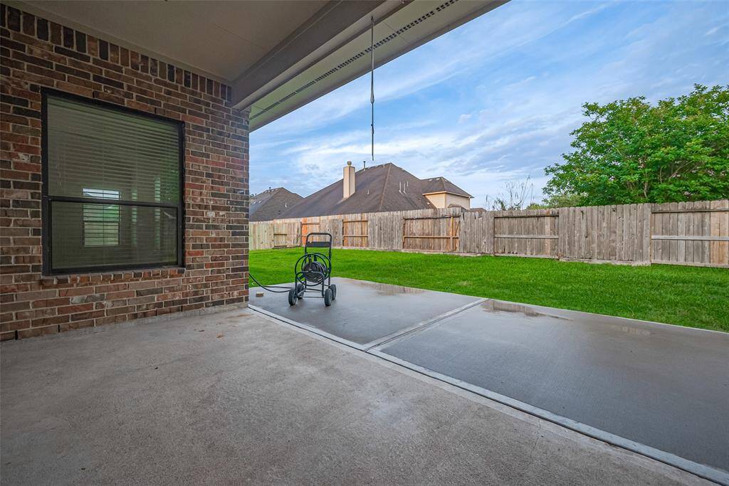 Covered back patio—perfect for morning coffee or evening relaxation