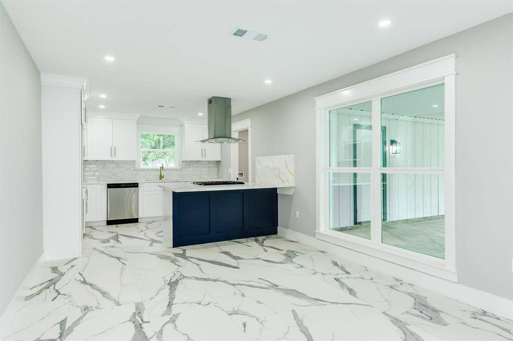 Stunning kitchen with island and breakfast bar.