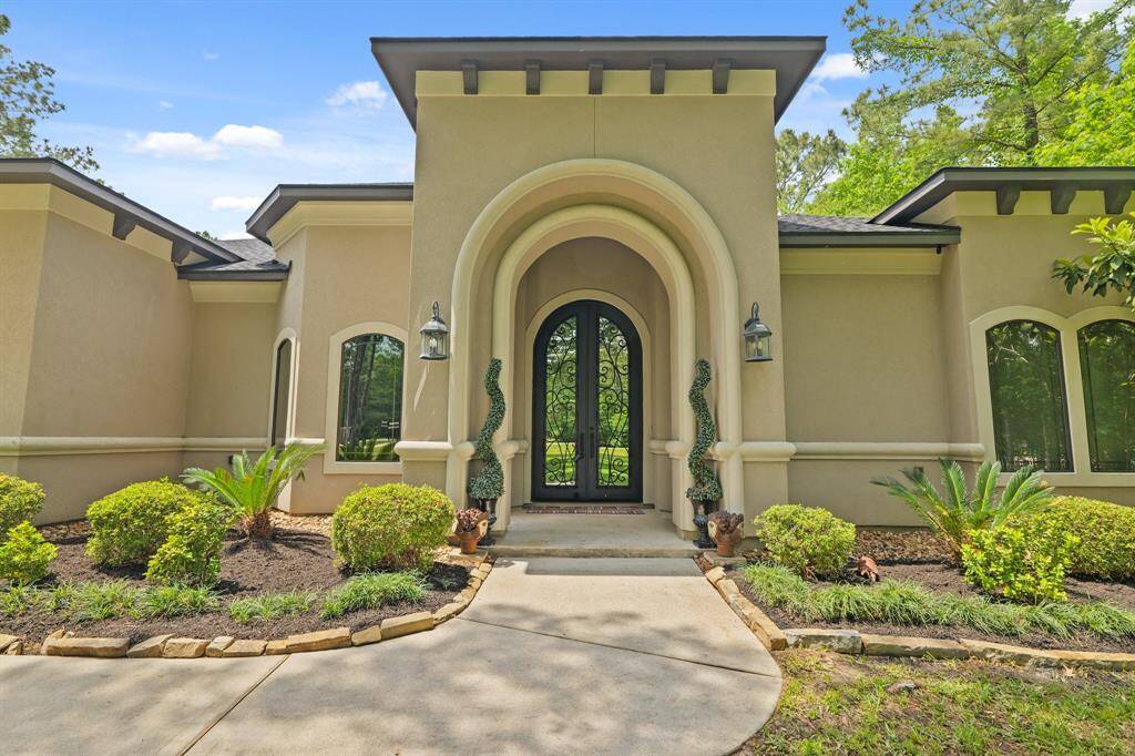 Charming home at 11058 Crawford Circle, Montgomery, TX 77316. This elegant residence features a welcoming entrance and beautifully landscaped front yard, perfect for serene living.