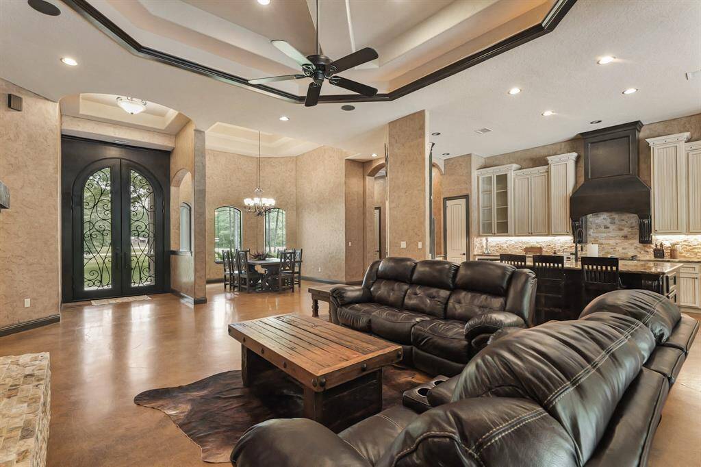 Spacious family room with seamless flow to the elegant dining area and grand entryway.