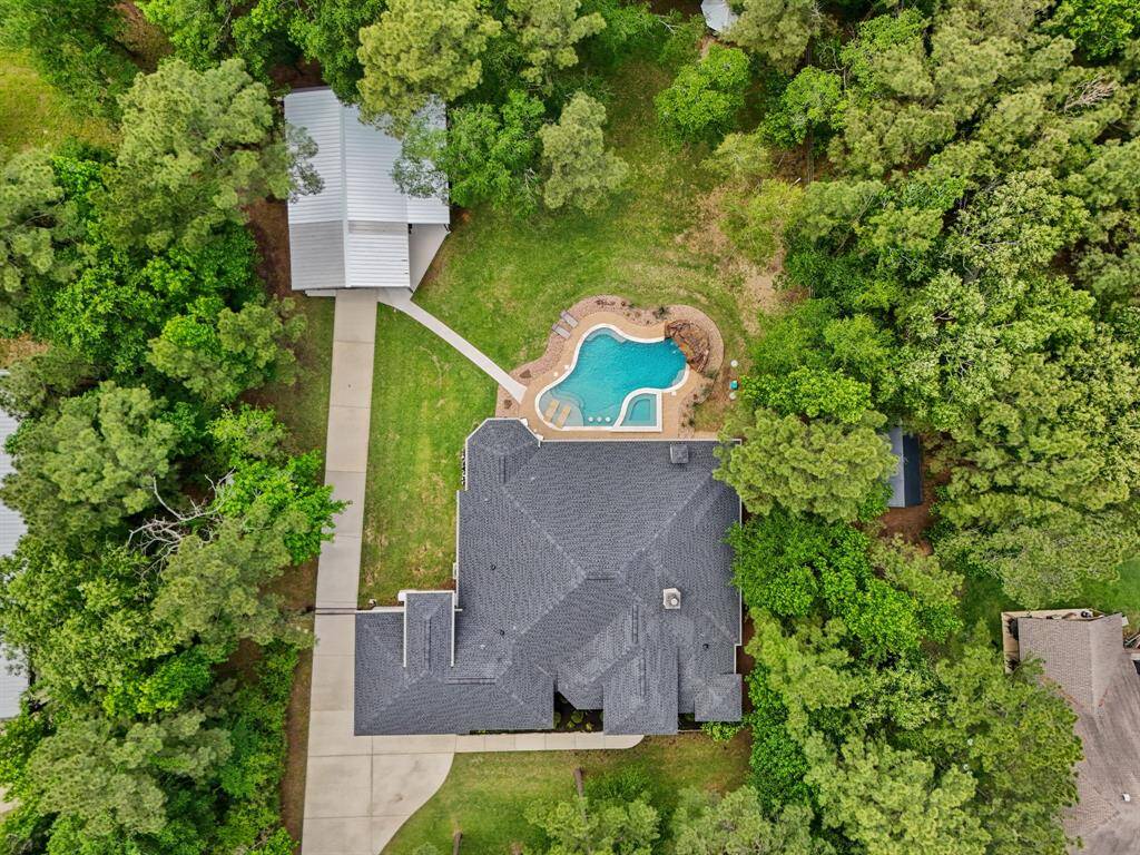 Discover your dream home at 11058 Crawford Circle, Montgomery, TX. This stunning property features a spacious layout, lush greenery, and a sparkling pool—perfect for relaxation and entertaining.