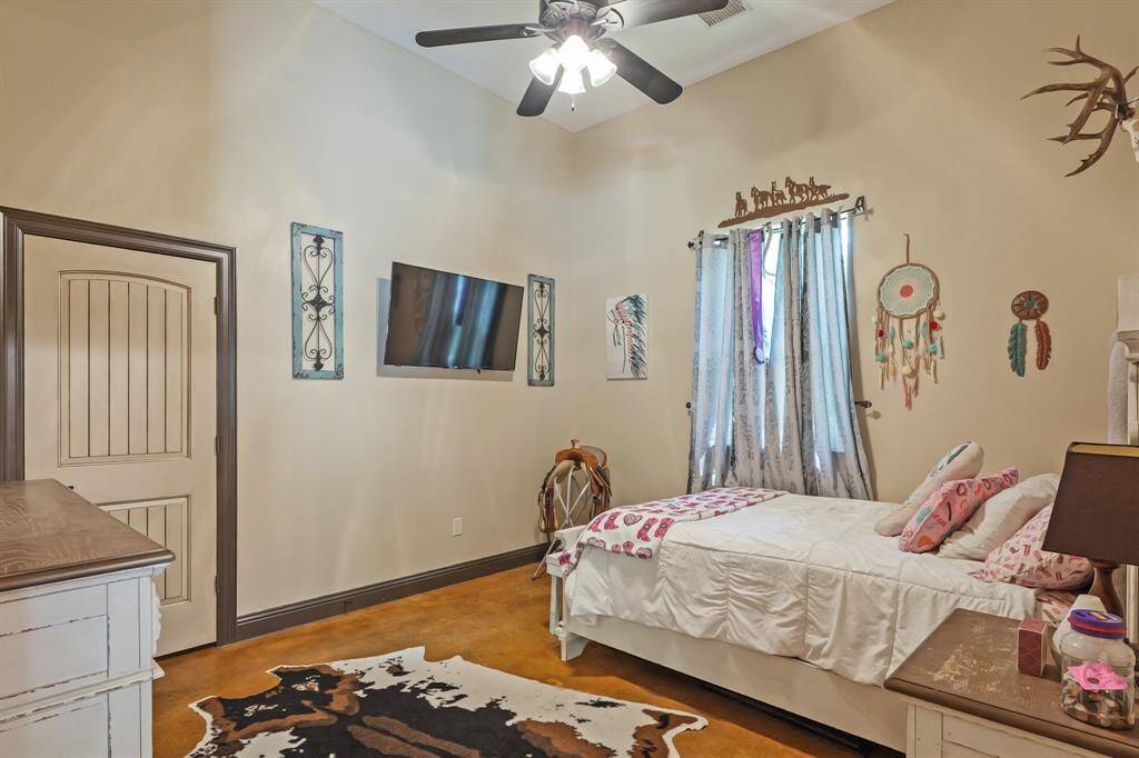 Cozy fourth bedroom featuring natural light and stylish decor, perfect for relaxation or a home office.