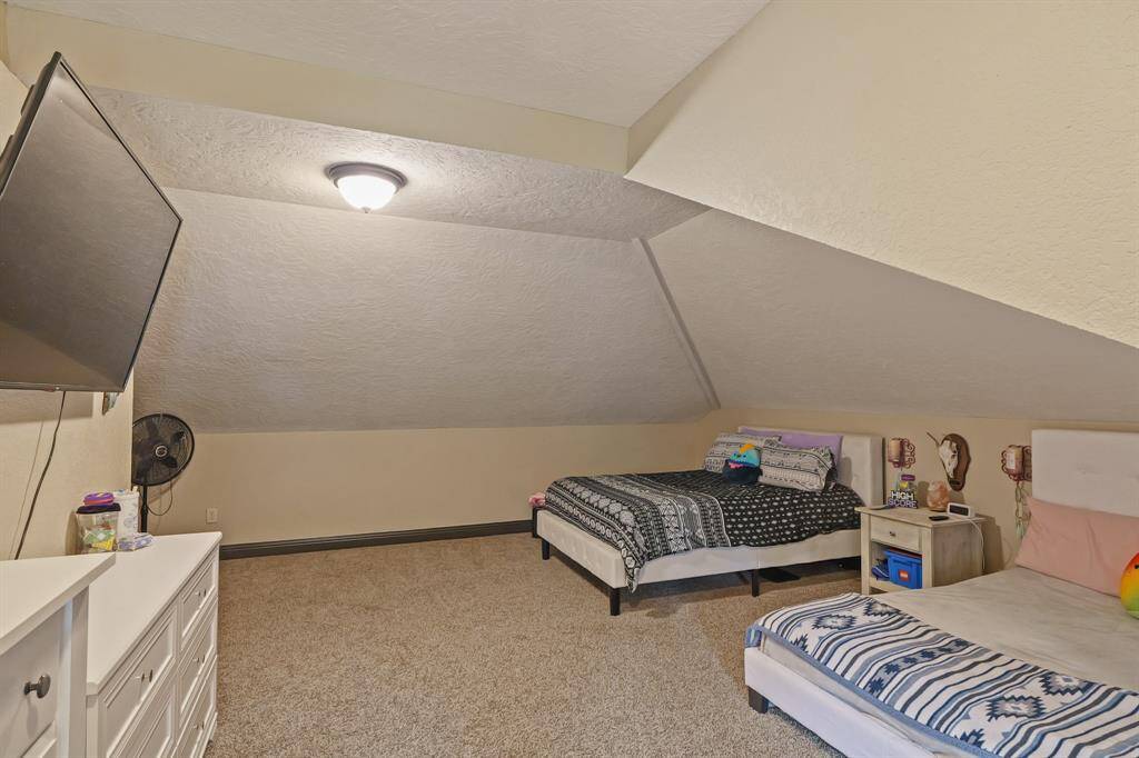 Versatile space perfect for a game room or a cozy 5th bedroom.