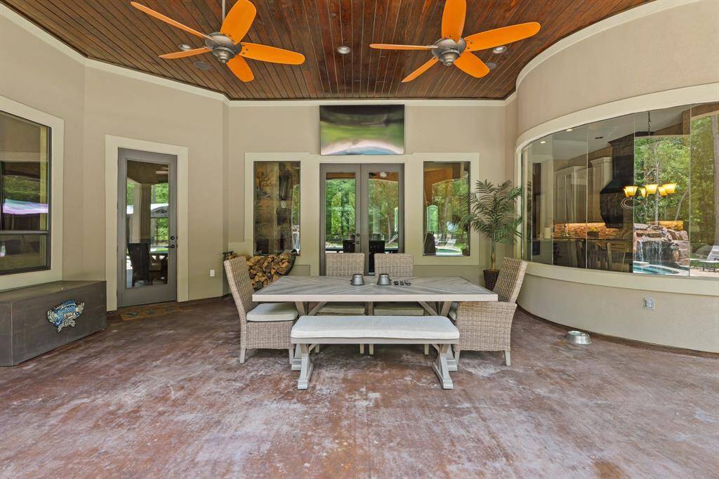 Enjoy stunning views of the pool and patio through expansive bay windows in the breakfast room.