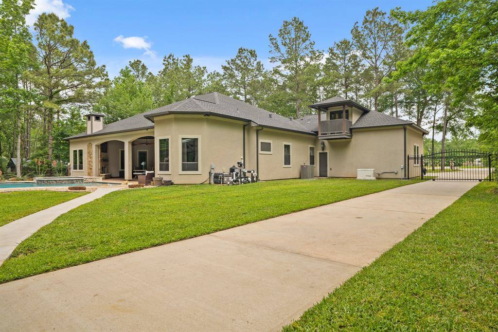 Luxurious home with a brand-new 2023 pool, 22KW Generac generator, private gate, and stunning balcony views!