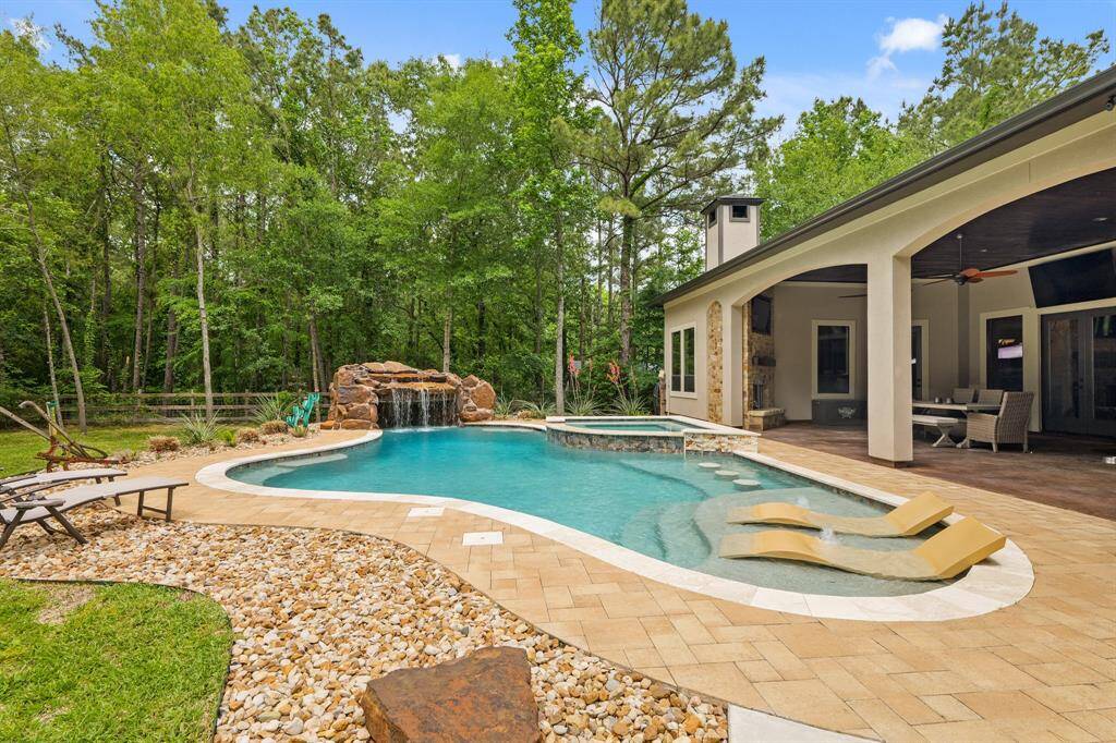 Experience luxury with a stunning pool featuring a 9-foot deep end, perfect for relaxation and entertainment.