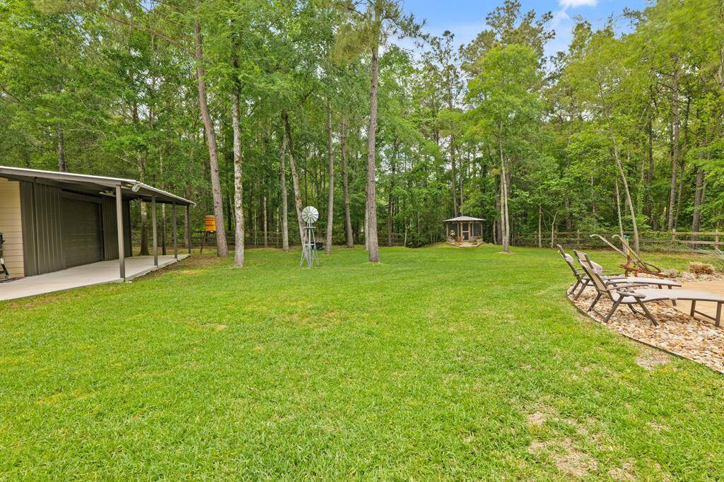 Charming chicken coop nestled in expansive, picturesque grounds.