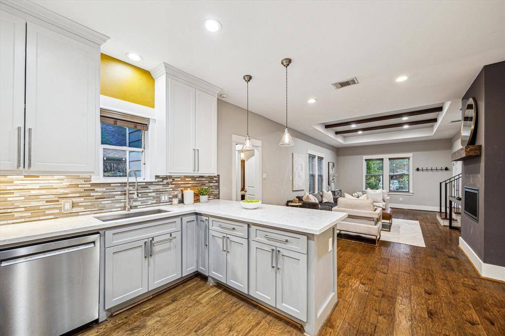 The kitchen is sleek and practical with tons of greatstorage! All appliances STAY!