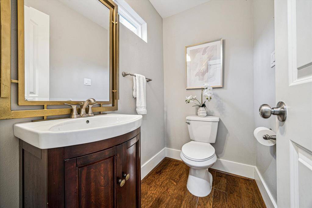 This is one of two bathrooms on the first floor. This is a half bathroom for guests right behind the living room.