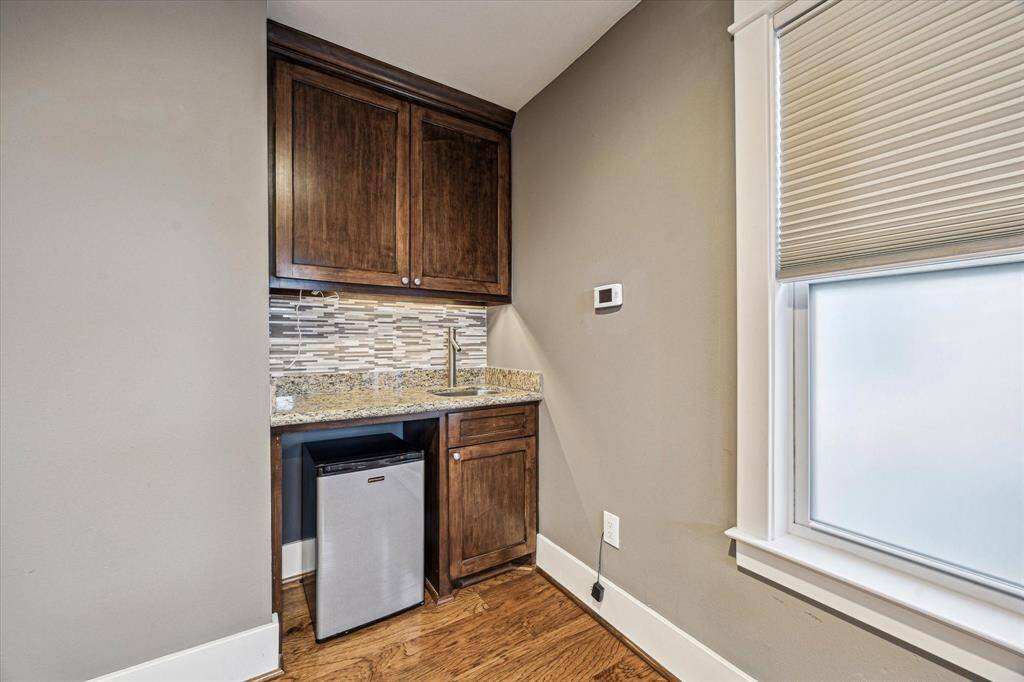 The primary bedroom features a built in bararea so you don't have to walk far for a night cap or coffee break.
