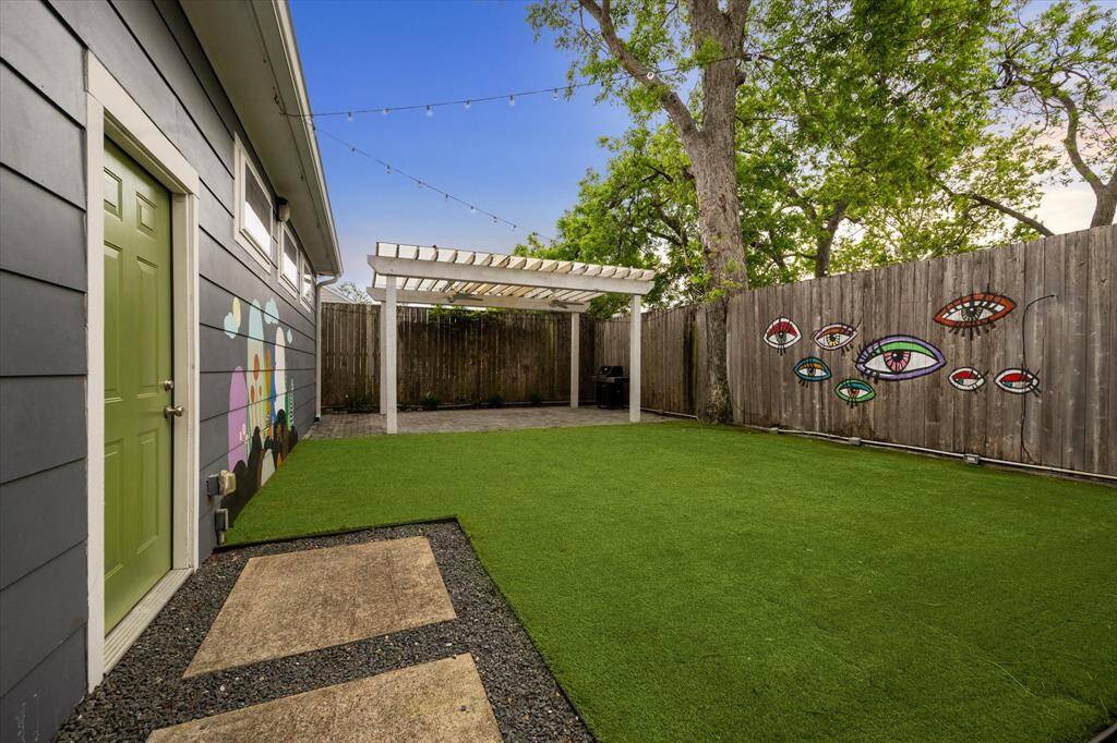 Now we head to the backyard - The garage isdetached and the turfed area is plenty big enough fordogs or kids to play!