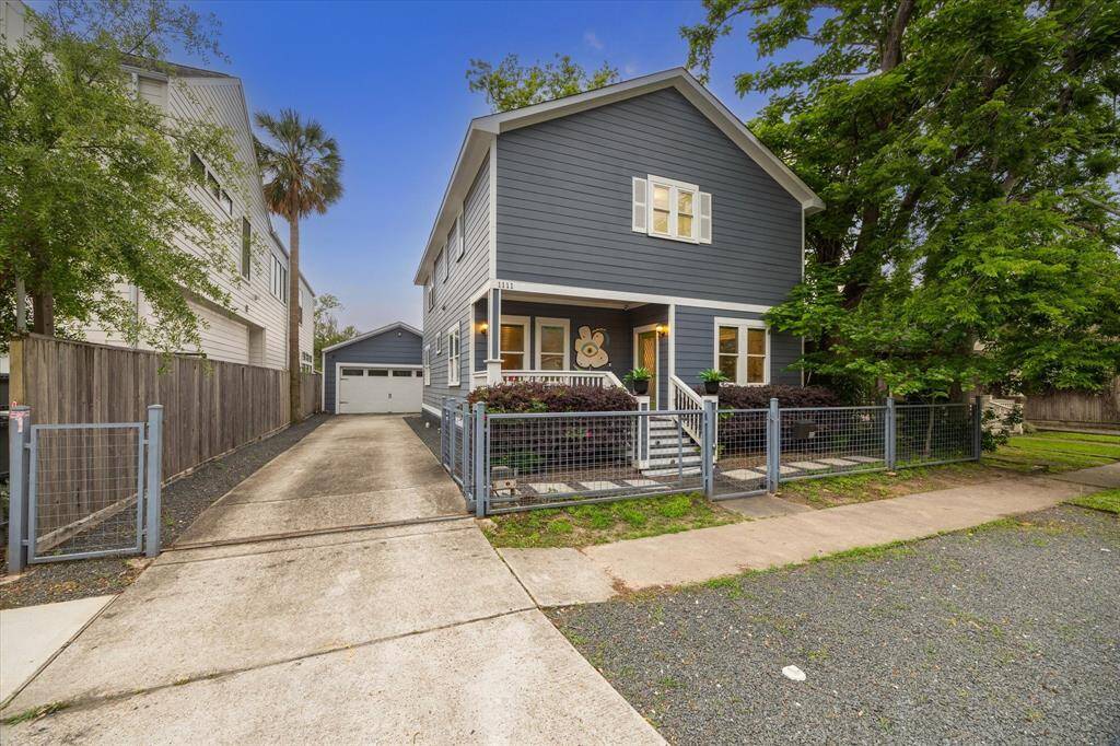 Long, paved driveway is fully fenced and has an electronic gate for added security. The oversized detached garage is at the very end.